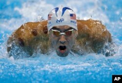 United States' Michael Phelps competes in a men's 200-meter butterfly heat during the swimming competitions at the 2016 Summer Olympics, Aug. 8, 2016, in Rio de Janeiro, Brazil.