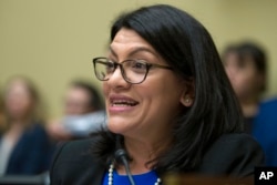 Rep. Rashida Tlaib, D-Mich., questions Michael Cohen, President Donald Trump's former lawyer, as he testifies before the House Oversight and Reform Committee, on Capitol Hill, Feb. 27, 2019, in Washington.
