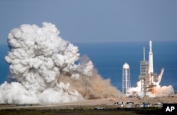 The Falcon Heavy has three first-stage boosters, strapped together with 27 engines in all.