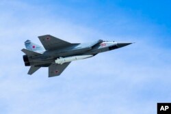 A Russian Air Force MiG-31K jet carries a high-precision hypersonic aero-ballistic missile Kh-47M2 Kinzhal during the Victory Day military parade to celebrate 73 years since the end of WWII and the defeat of Nazi Germany, in Moscow, Russia, May 9, 2018