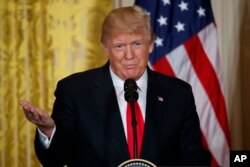 U.S. President Donald Trump speaks during a news conference in the East Room of the White House, Jan. 10, 2018, in Washington.