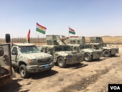 Iraqi Kurdish Peshmerga vehicles line up outside their new base in a house that they retook from IS in an offensive that pushed the frontline 23 kms closer to the IS stronghold of Mosul, June 6, 2016. (S. Behn/VOA)