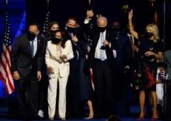 Democratic 2020 U.S. presidential nominee Joe Biden celebrates onstage at his election rally in Wilmington