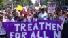 FILE - Activists march in Durban, South Africa, July 18, 2016, at the start of the 21st World AIDS Conference to demand that funds not be cut in the fight against HIV/AIDS. Eight years later, great progress has been made in the battle, but dwindling funding remains an issue.
