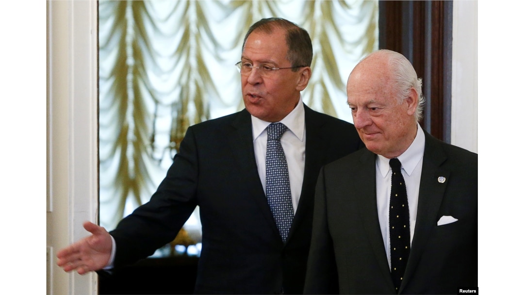 Russian Foreign Minister Sergei Lavrov (L) shows the way to United Nations special envoy on Syria Staffan de Mistura during a meeting in Moscow, Russia, May 3, 2016.