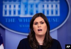 White House press secretary Sarah Huckabee Sanders talks to reporters during a press briefing in the Brady press briefing room at the White House, in Washington, Jan. 11, 2018.