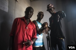 South Sudanese rapper Lual D'awol poses with fellow hip-hop artists in a recording studio in Juba, June 4, 2016. (J. Patinkin/VOA)