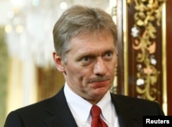 FILE - Kremlin spokesman Dmitry Peskov attends a meeting of Russian President Vladimir Putin with Japanese Prime Minister Shinzo Abe at the Kremlin in Moscow, Russia, April 27, 2017.