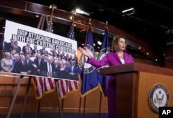 House Minority Leader Nancy Pelosi, D-Calif., speaks with reporters in advance of votes on two broad immigration bills, deriding the Republican immigration legislation as a "compromise with the devil," at the Capitol in Washington, June 21, 2018.