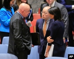 United Nations Ambassadors Vasily Nebenzya of Russia, left, Liu Jieyi of China, center, and Nikki Haley of the U.S., right, confer after the United Nations nonproliferation meeting on North Korea, Sept. 4, 2017 at U.N. headquarters.