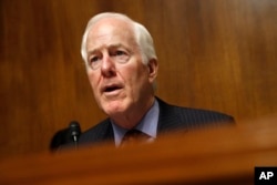 FILE - Senate Majority Whip Sen. John Cornyn, R-Texas, Chair of the Senate Judiciary Border Security and Immigration Subcommittee, speaks during a hearing about the border, May 8, 2019, on Capitol Hill in Washington.