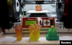 A 3D printer for consumers capable of creating multicolor objects is demonstrated at the opening event at the Consumer Electronics Show in Las Vegas January 4, 2016. The unit will be available later this year for $499, according to the company.