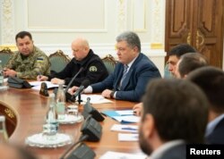 Ukrainian President Petro Poroshenko chairs a meeting of the National Security and Defense Council in Kyiv, Ukraine, Nov. 26, 2018.