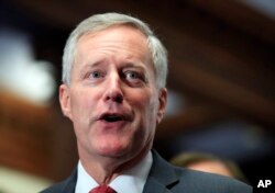 FILE - Freedom Caucus Chairman Rep. Mark Meadows, R-S.C., speaks to reporters on Capitol Hill in Washington.