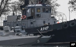 The damage on one of three Ukrainian ships is seen after it had been seized, Nov. 25, 2018, in Kerch, Crimea.