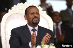 FILE - Ethiopia's prime minister, Abiy Ahmed, attends a rally during his visit to Ambo in the Oromiya region of Ethiopia, April 11, 2018.