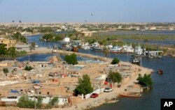 This aerial photo shows high levels of water in the Shatt al-Arab waterway near Basra, Iraq, April 22, 2019.