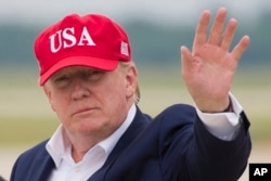 FILE - President Donald Trump waves as he steps off Air Force One after arriving at Andrews Air Force Base, Md., June 7, 2019.