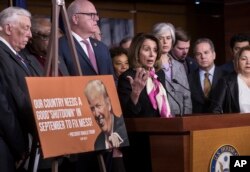 House Minority Leader Nancy Pelosi, D-Calif., center, speaks at a news conference, joined by, from left, Minority Whip Steny Hoyer, D-Md., and Rep. Joseph Crowley, D-N.Y., on the first morning of a government shutdown, at the Capitol in Washington, Jan. 20, 2018.