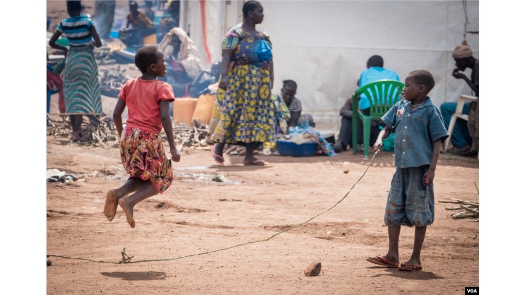 Congolese refugees jump rope at the Kagoma reception center in Kyangwali district Western Uganda. ( H. Athumani for VOA)
