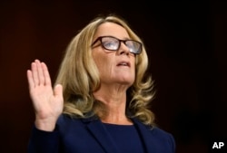 Christine Blasey Ford is sworn in before the Senate Judiciary Committee, Sept. 27, 2018, on Capitol Hill in Washington.