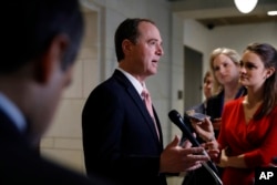FILE - Rep. Adam Schiff, D-Calif., ranking member on the House intelligence committee, speaks to reporters after the committee interviewed former White House strategist Steve Bannon, Feb. 15, 2018, on Capitol Hill in Washington.