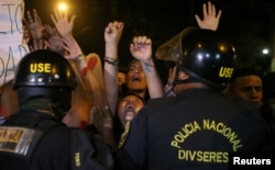 Protesters march near Centerio hospital after Peruvian President Pedro Pablo Kuczynski pardoned former President Alberto Fujimori in Lima, Dec. 25, 2017.