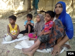 FILE - To escape violence in Rakhine state during the military crackdown there, in November 2016, Rohingya woman Haresa Begum fled to Bangladesh with her four children, leaving her husband in Myanmar.