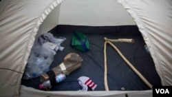 As well as the wooden camera, a specially carved tripod is a more recent addition to the Refugee.tv’s gear (J. Owens/VOA).