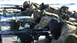 Russian soldiers take part in drills at the Kadamovskiy firing range in the Rostov region in southern Russia, Jan. 13, 2022.