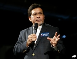 Former U.S. Attorney General Alberto Gonzales introduces Republican presidential candidate Ohio Gov. John Kasich at a rally, Feb. 27, 2016, in Nashville, Tennessee.