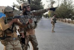 Afghan Special forces patrol a deserted street during fighting with Taliban fighters, in Lashkar Gah, Helmand province, southern Afghanistan, Tuesday, Aug. 3, 2021.