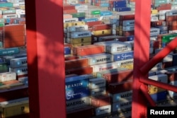 FILE - Containers are seen at the Yangshan Deep Water Port, part of the Shanghai Free Trade Zone, in Shanghai, China, Sept. 24, 2016.