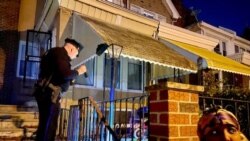 Philadelphia Police Officer Shawn Wills investigates a double shooting. The city homicide rate has exacerbated Covid-19 stress for emergency room nurses. (Carolyn Presutti/VOA)