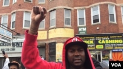 Residents of the Sandtown neighborhood in Baltimore, Maryland react to the State's Attorney's announcement ruling Freddie Gray's death a homicide, May 1, 2015. (Photo: C. Simkins / VOA)
