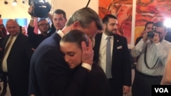 Far-right candidate Norbert Hofer hugs daughter following his election defeat, in Vienna, Austria, Dec. 4, 2016 (L. Ramirez/VOA). Hofer has vowed to continue his fight.