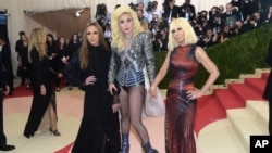Allegra Versace, from left, Lady Gaga and Donatella Versace arrive at The Metropolitan Museum of Art Costume Institute Benefit Gala, celebrating the opening of "Manus x Machina: Fashion in an Age of Technology" on May 2, 2016, in New York.