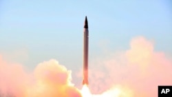 This photo released by the official website of the Iranian Defense Ministry on Sunday, Oct. 11, 2015, claims to show the launching of an Emad long-range ballistic surface-to-surface missile in an undisclosed location.