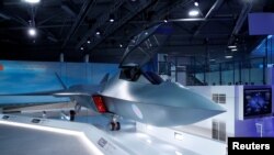 FILE - A model of a new British fighter jet, called Tempest, is unveiled at the Farnborough Airshow, in Farnborough, Britain, July 16, 2018.