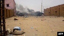 Smoke billows from an army armored vehicle after an explosion in Gao, northern Mali, July 1, 2018.