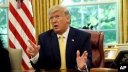 President Donald Trump meets with Chinese Vice Premier Liu He in the Oval Office of the White House in Washington, Friday, Oct. 11, 2019.