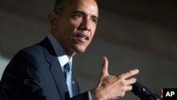 Presiden AS Barack Obama berbicara di Museum Arsip Nasional di Washington DC, hari Selasa (15/12) .