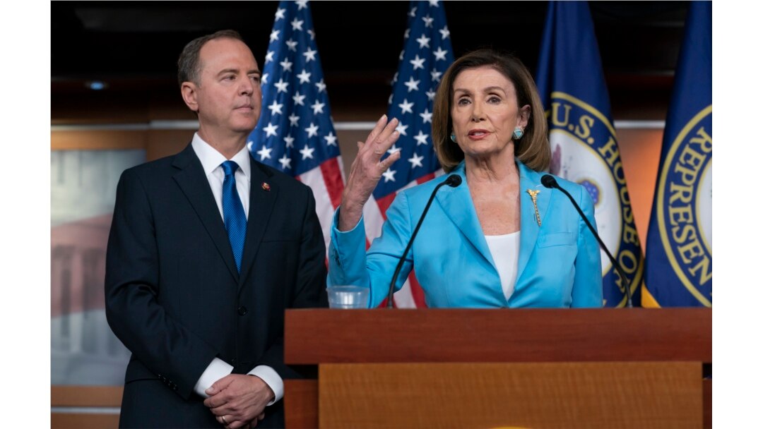 FILE - Speaker of the House Nancy Pelosi is joined by House Intelligence Committee Chairman Adam Schiff at a news conference at the Capitol, in Washington, Oct. 2, 2019.