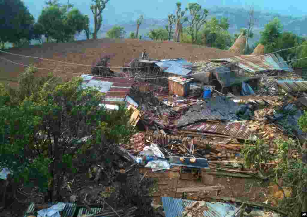 In this photo provided by World Vision, houses lie destroyed by Saturday’s earthquake at Paslang village in Gorkha municipality, Nepal on April 27, 2015.