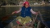 Chrifa Nimri arranges a net after returning from fishing at the seaport Sidi Bou Said, in Tunis.