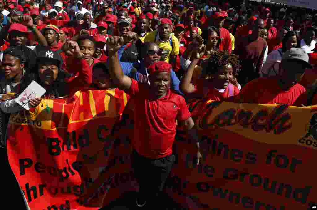 Workers take part in a May Day march to the Johannesburg Stock Exchange building on May 1, 2017.