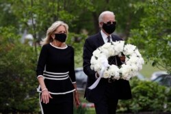 Democratic presidential candidate, former Vice President Joe Biden, and his wife Jill Biden arrive to place a wreath at the Delaware Memorial Bridge Veterans Memorial Park, in New Castle, Delaware, May 25, 2020.