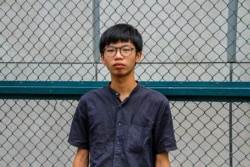 FILE - Tony Chung was found guilty of unlawful assembly and desecrating the national flag. He will be sentenced on Dec. 29, 2020. Photo taken in Mongkok, Hong Kong, Oct. 2020. (Tommy Walker/VOA)