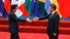 As Trade War Persists, Japan's Abe Heads for First Visit to China