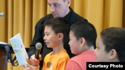 Children awaiting their turn to read while poet and educator Dave Johnson looks on. (Jayne Parker/Poets House)